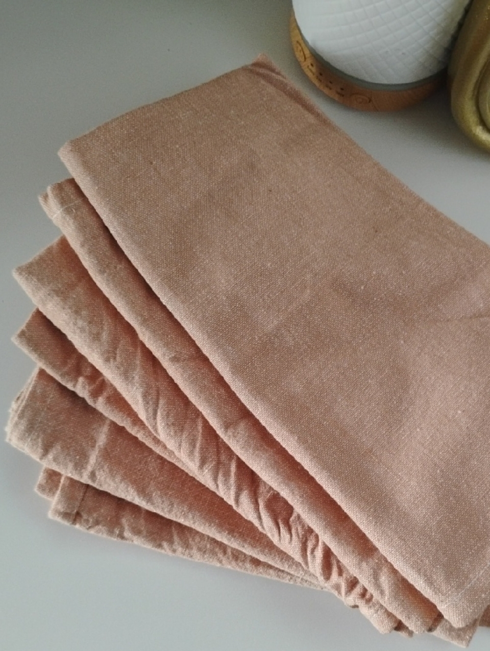 half-dozen blush pink cotton napkins.